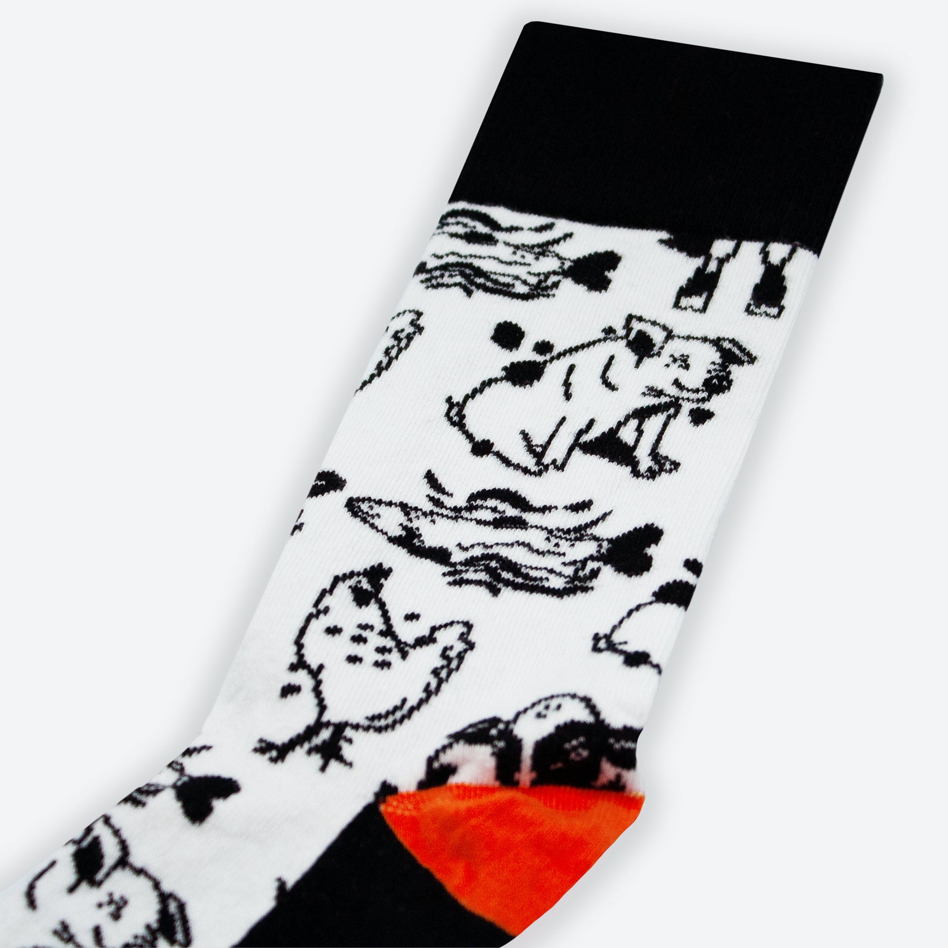 One sock showing detailed animal illustrations in black and white.