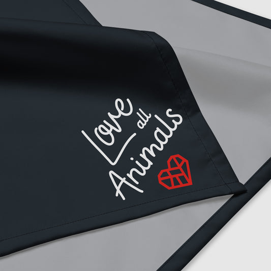 Black bandana with the words "Love all Animals" printed in a white cursive font with The Humane League's red Mended Heart icon underneath the words. The bandana has a white, un-printed underside.