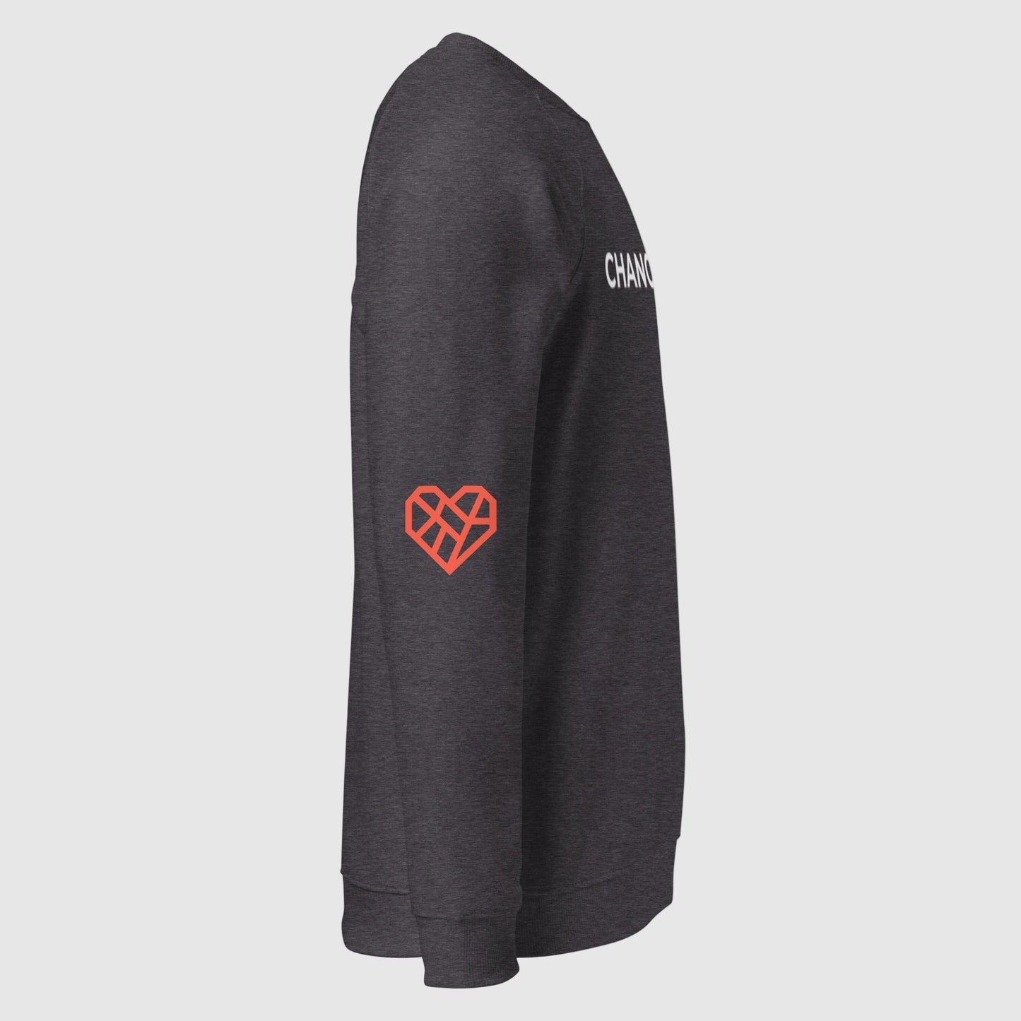 Close up of the sweatshirt showing the front Changemaker design. The sleeve is folded over to show The Humane League's red Mended Heart icon is printed on the elbow.