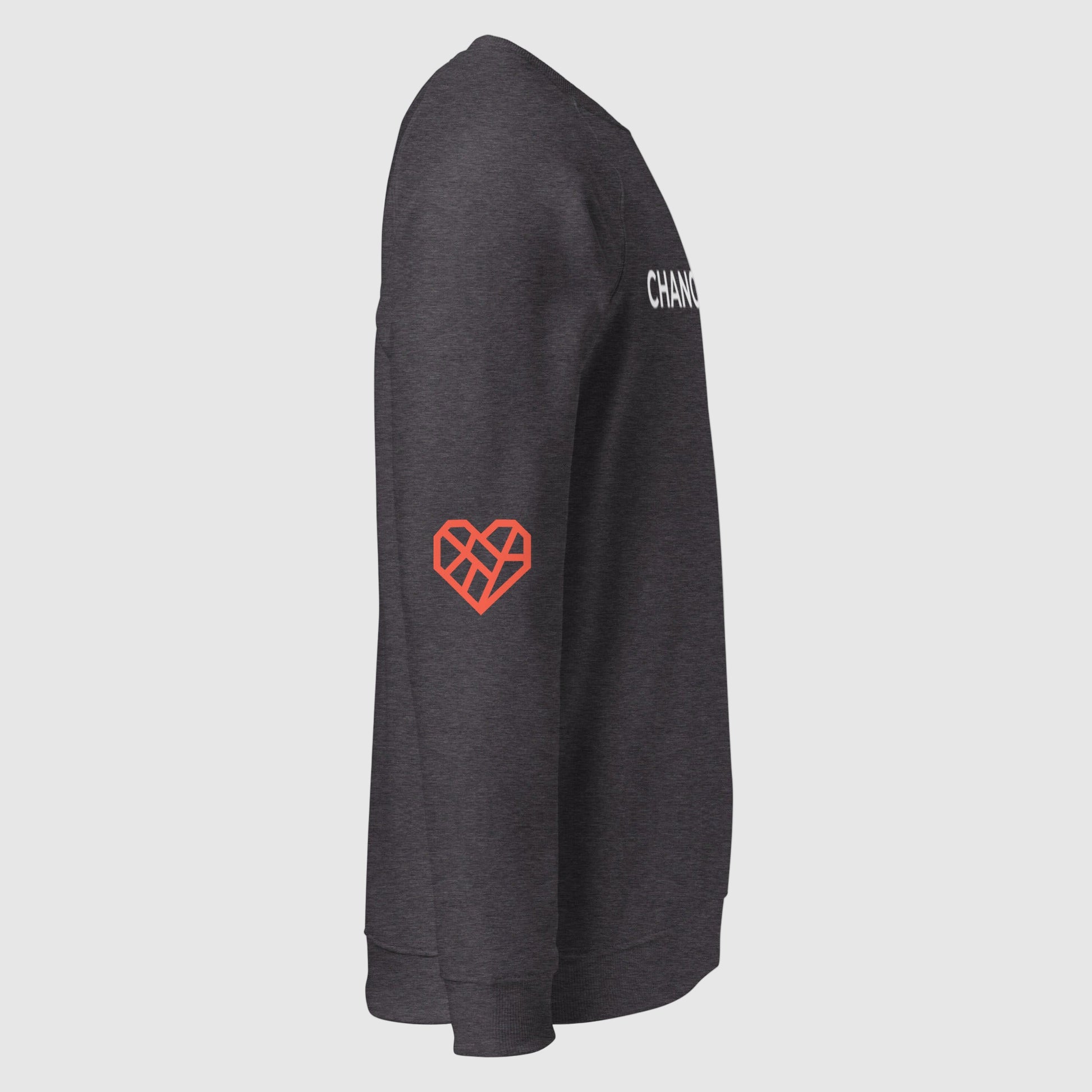 Close up of the sweatshirt showing the front Changemaker design. The sleeve is folded over to show The Humane League's red Mended Heart icon is printed on the elbow.