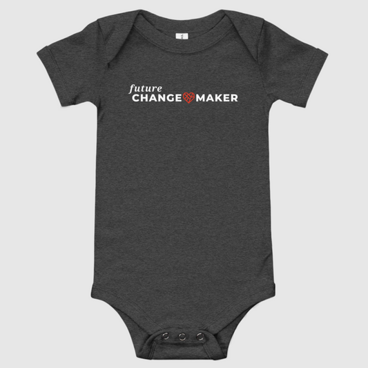 A dark grey infant bodysuit that says "future Changemaker in white text on the front. A red geometric heart shape is between the words Change and Maker. There is a three-snap closure at the bottom.