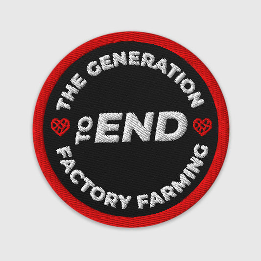 Round patch with white text 'The Generation to End Factory Farming' on a black background with red border.