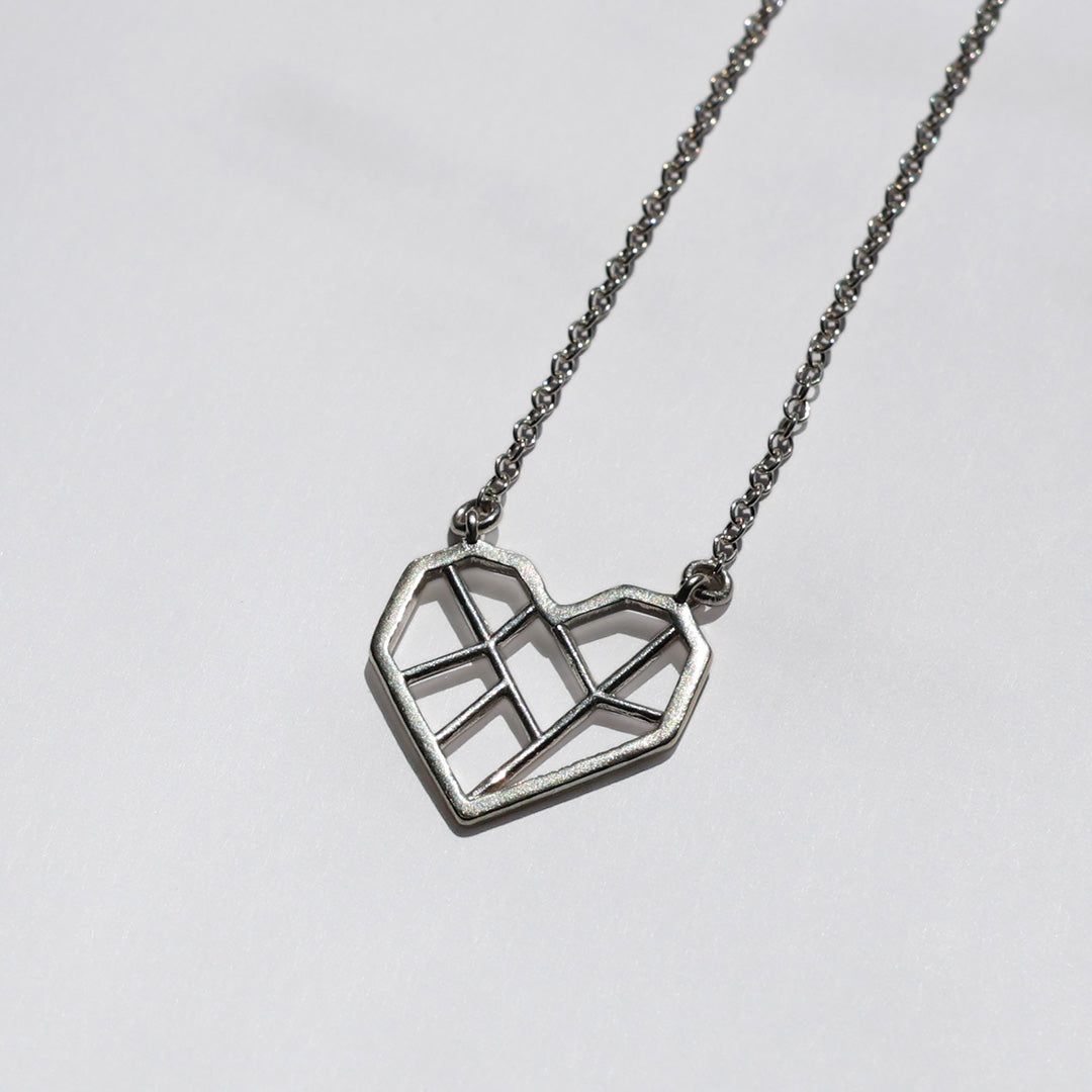 Silver necklace with geometric heart pendant