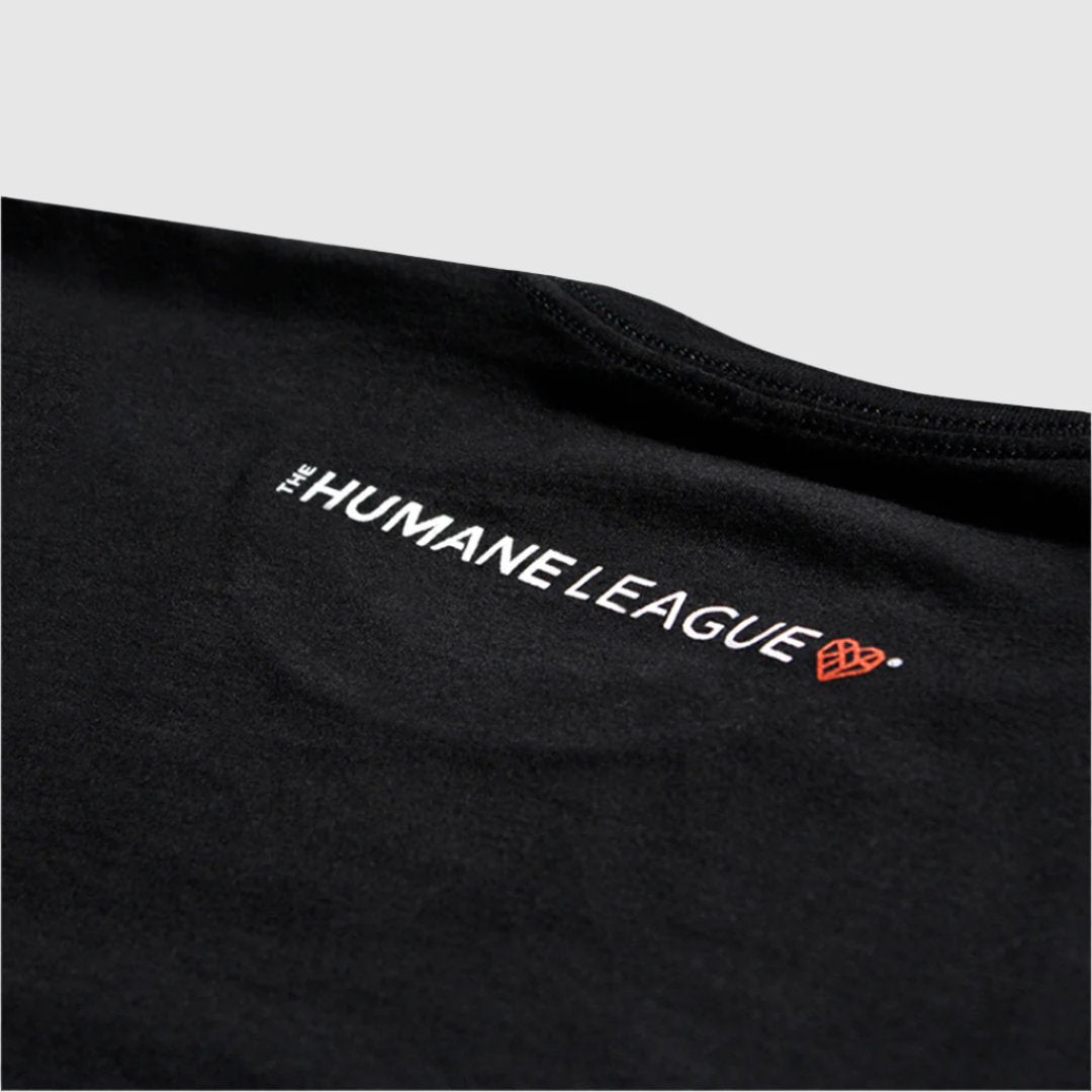 Close up of the logo on the upper back of the t-shirt