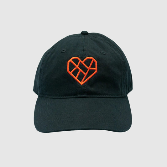 A black baseball cap with a red geometric heart design embroidered on the front. The heart design is composed of angular lines forming an abstract, lattice-like pattern. The cap has a classic six-panel structure with a curved brim, photographed against a white background.