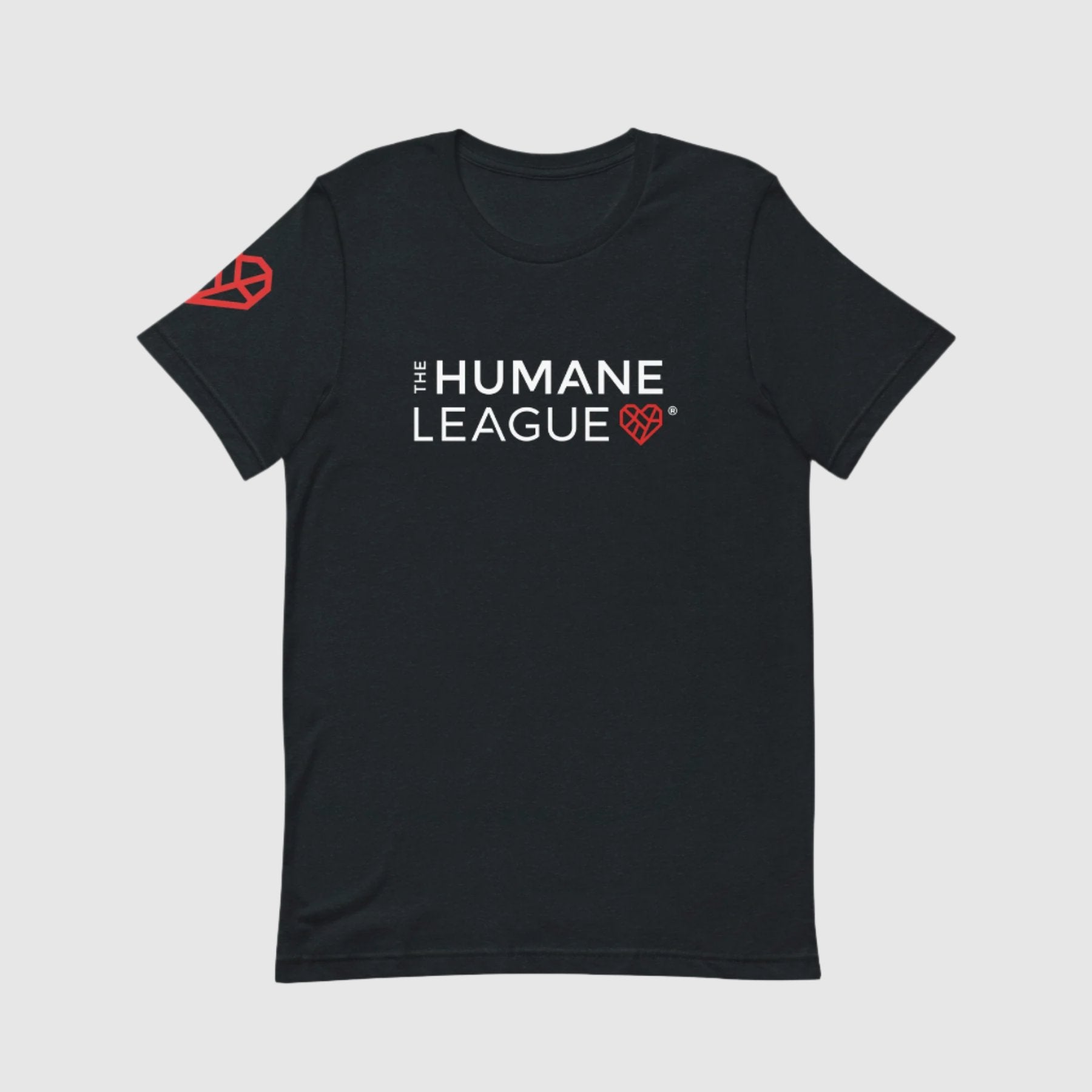 A dark gray t-shirt with "THE HUMANE LEAGUE" printed in white, using an all-caps font across the chest. Next to the text is a red geometric heart icon. The shirt also features the same heart icon on the wearer's right sleeve. 