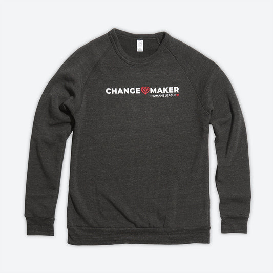 Dark charcoal grey sweatshirt with long sleeves. The front says Changemaker in white with The Humane League logo. A Mended Heart is in between the words Change and Maker.